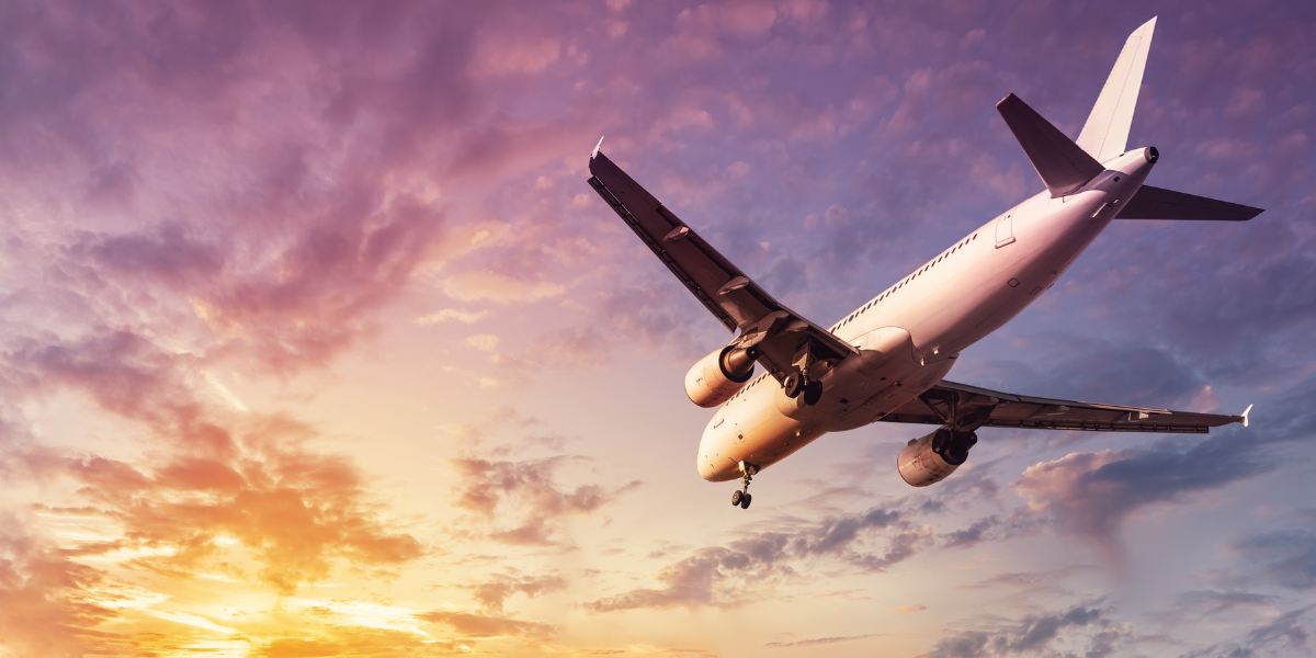 A commercial plane taking off with a sunset showing an application for epoxy resins which could utilise AEROSIL fumed silica for rheology control and reinforcement